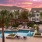 Large pool with shaded seating and clubhouse access.
