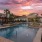 Large pool with shaded seating and clubhouse access.