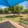 umbrella shaded area in spacious dog park with benches