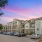two-story apartment buildings with parking spaces